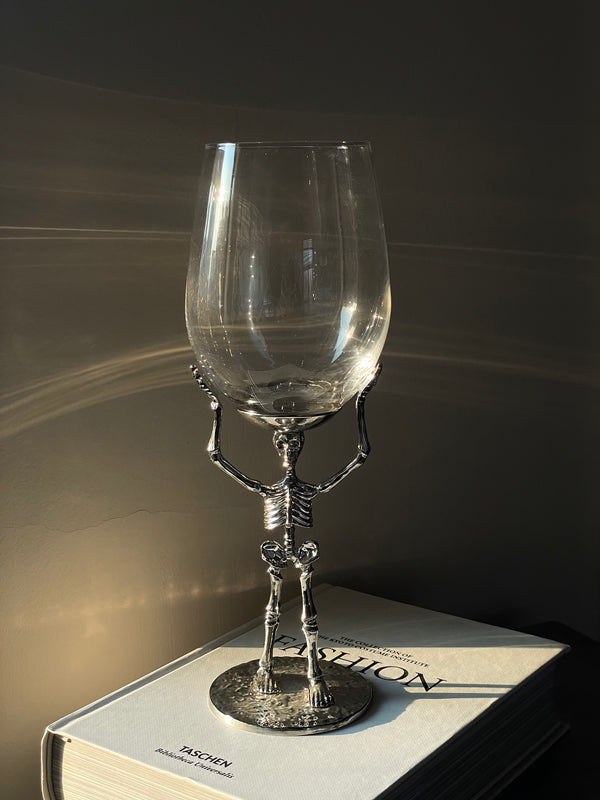 Skeleton Hand Champagne Flute & Skyline Red Wine Glass Set